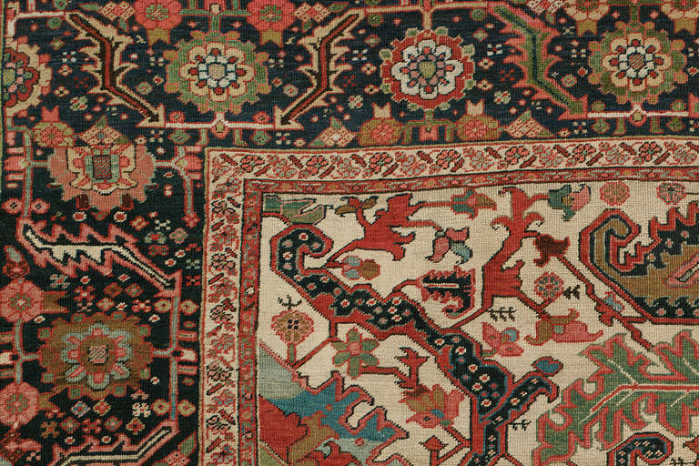 A stunning early 20th century Heriz Serapi rug. Heriz rugs are Persian rugs from the area of Heris, East Azerbaijan in northwest Iran, northeast of Tabriz. Such rugs are produced in the village of the same name in the slopes of Mount Sabalan. Heriz