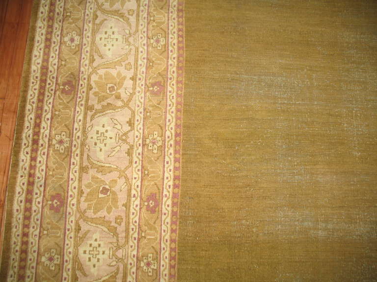 A late 19th century antique Indian Amritsar with a open pistachio field design surrounded by a pink and ivory border.