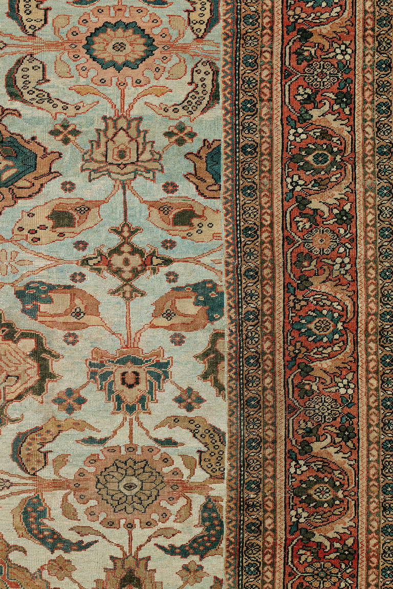 An early 20th century Persian Mahal Sultanabad rug with a powder blue all-over field and brown border, circa early 20th century.

Size: 14'2