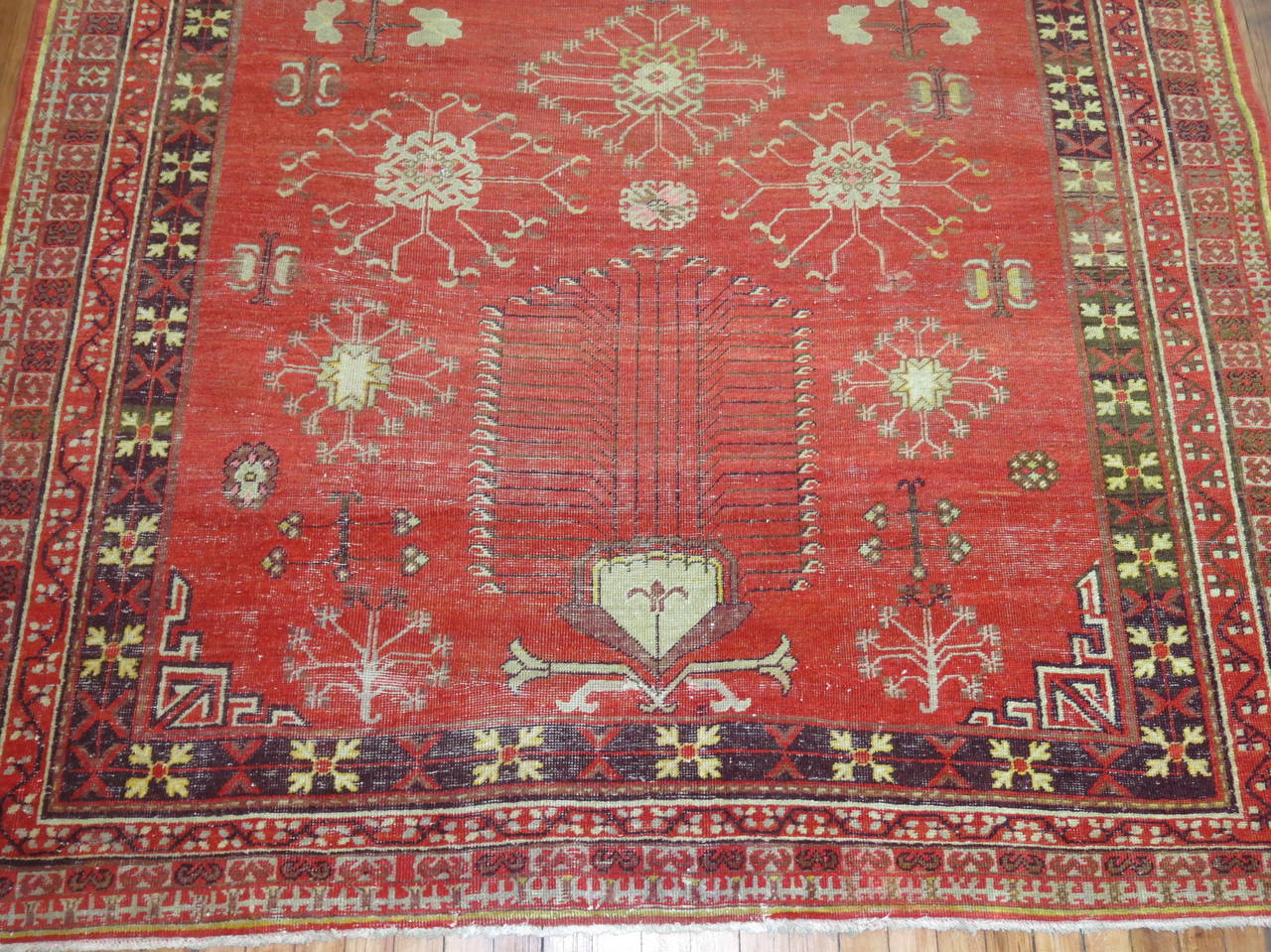 An early 20th century shabby chic Khotan gallery rug.