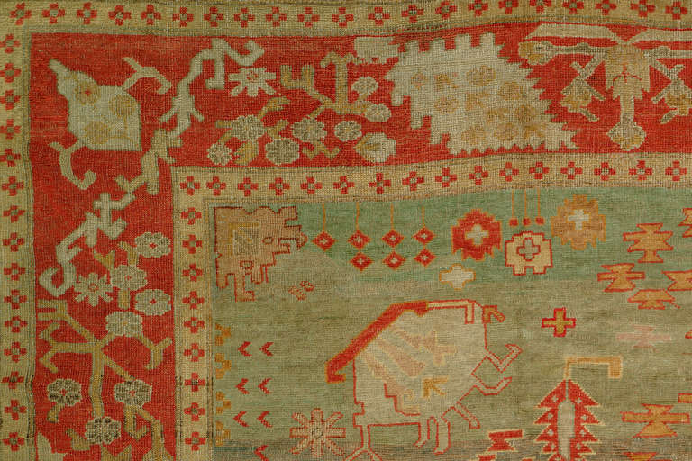 An authentic handmade colorful turn of the century Turkish Oushak rug.