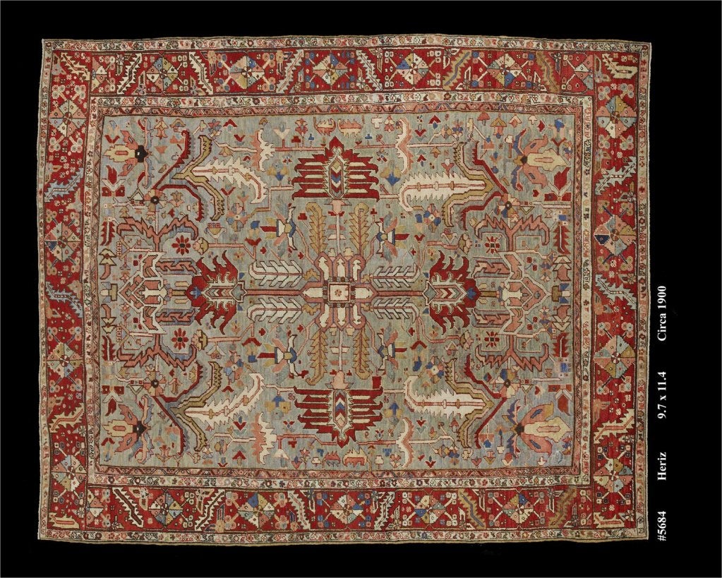 A beautiful antique persian heriz rug featuring a highly unusual sea foam green background. Very durable piece that can easily endure everyday traffic.