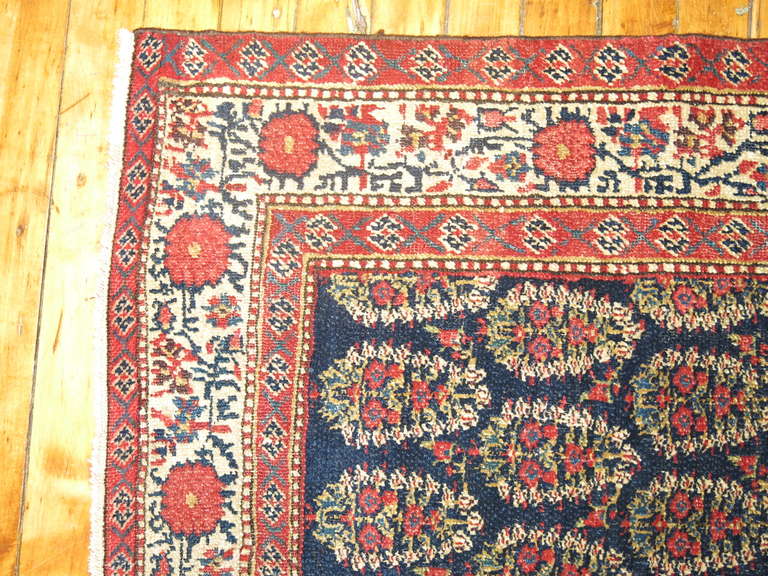 A long and narrow finely woven Persian runner featuring an all-over paisley design.

Measures: 2'7'' x 15'8''.