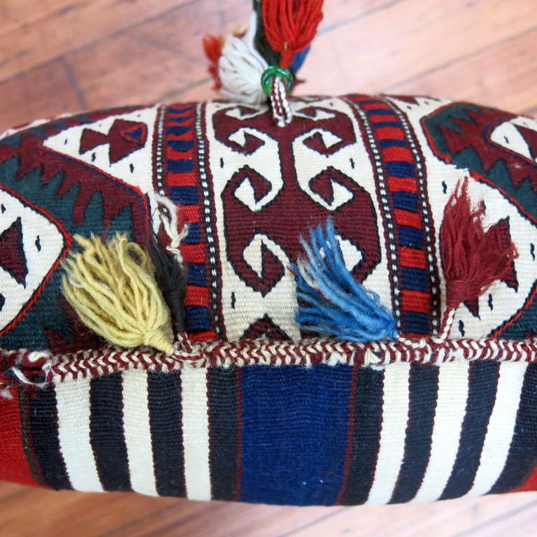A wonderful Turkemen pillow we acquired from a private estate. Sewn shut with polyfill insert. 18'' x 18''

The most valuable carpets, and textiles in the Turkemen yurt were always dowry pieces. For Turkmen women, weaving these pieces for their