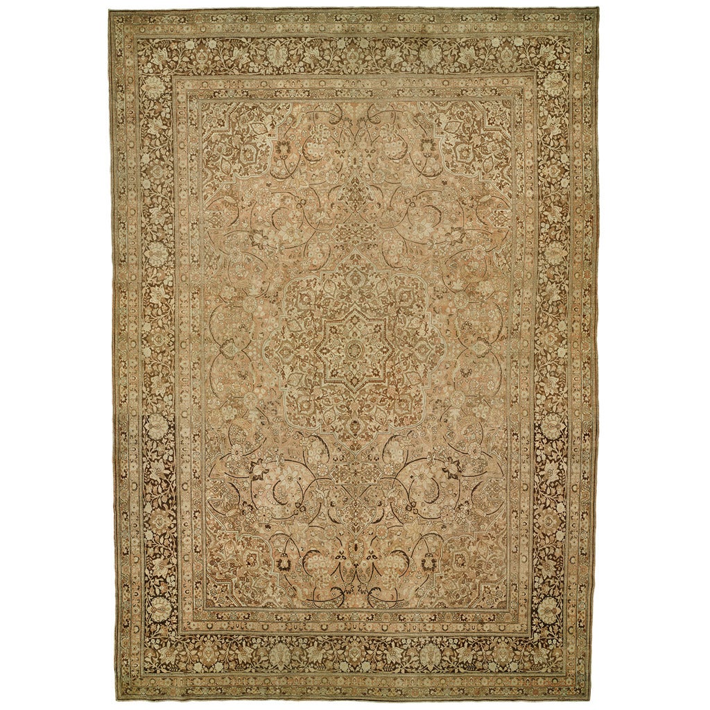 An early 20th century Persian Oversize Persian Tabriz rug.

13'9'' x 19'6''