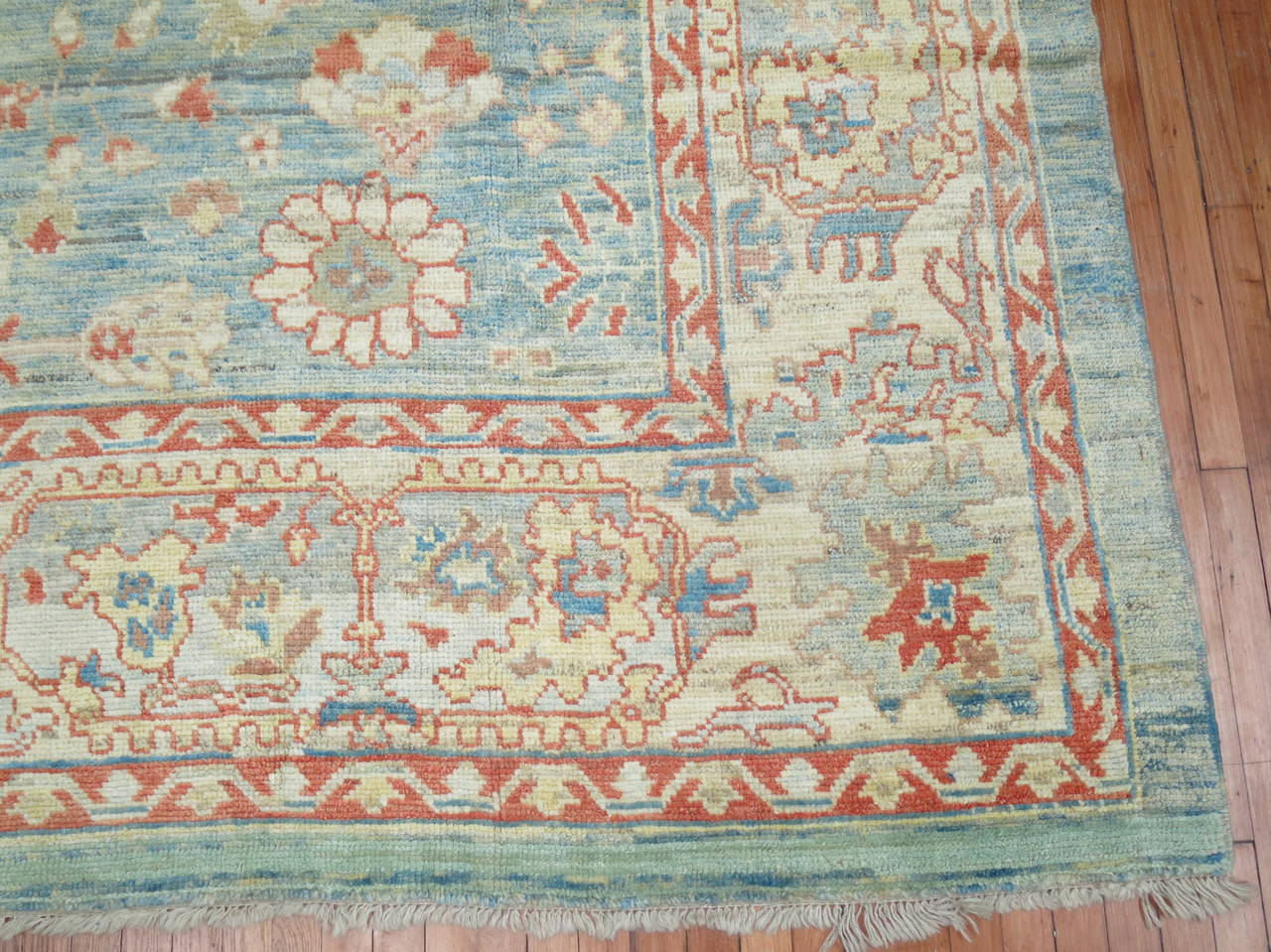 A Mid-Century Turkish Oushak in soft blues and corals.