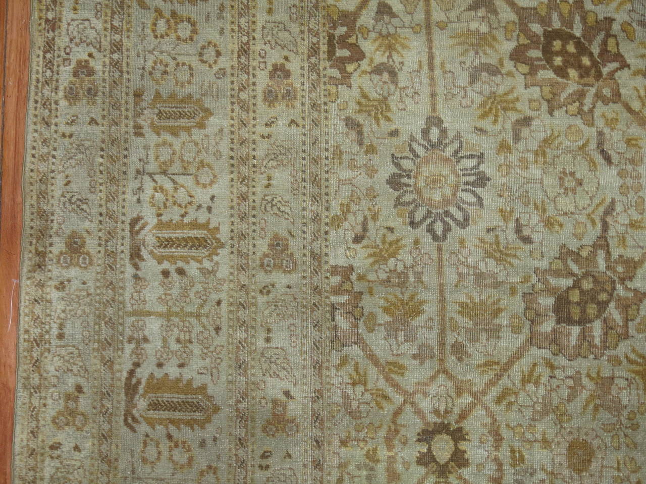 An early 20th century Persian Tabriz with an all-over design. Beige, brown, umber accents.

Measures: 9'3