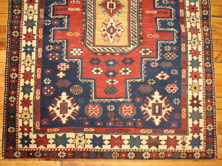 Late 19th century Caucasian shirvan rug featuring an off balanced medallion
