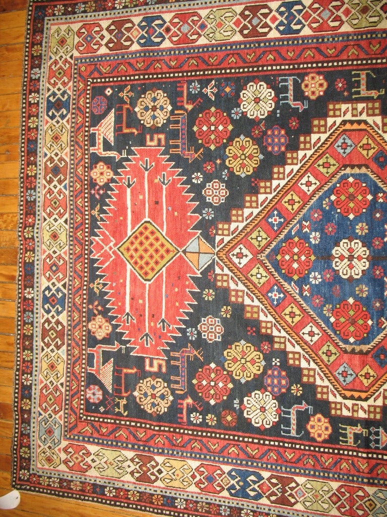 A rare size, authentic one-of-a-kind handmade late 19th century caucasian rug.