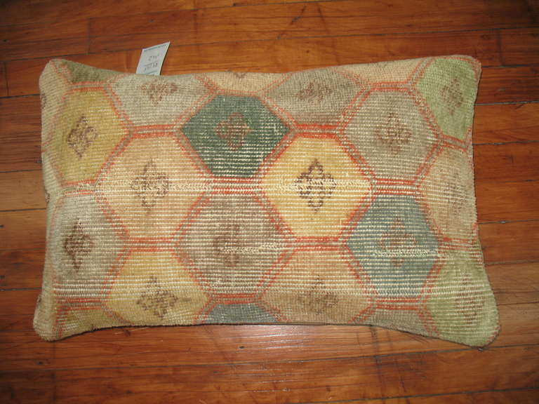 A mid century Turkish Anatolian rug in fun colors made into a pillow. Khaki cotton underside with a zipper closure included.  measures 15'' x 24''
