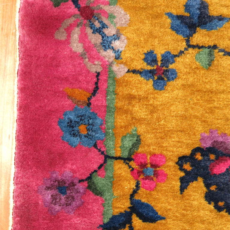 A vibrant, rare size Chinese art deco runner, Gold field & bright pink border