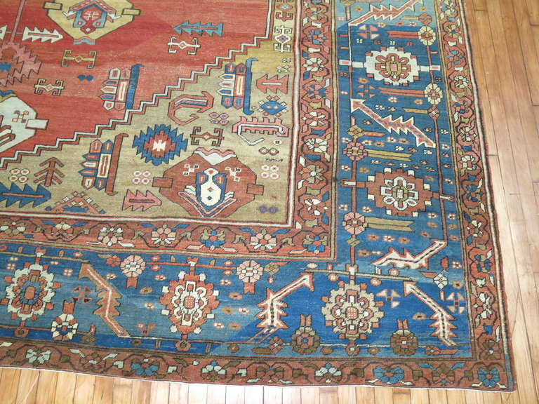 Wool Antique Persian Bakshaish Carpet in Rustic Tones For Sale