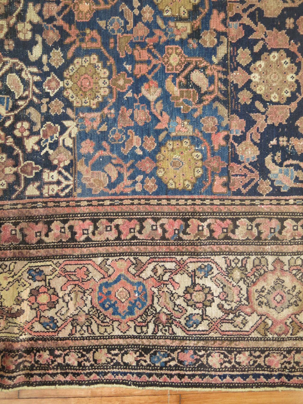 A rare size Persian Malayer rug with predominant accents in beige and dusty rose on an Abrash blue field,

circa 1920, measures: 10'7