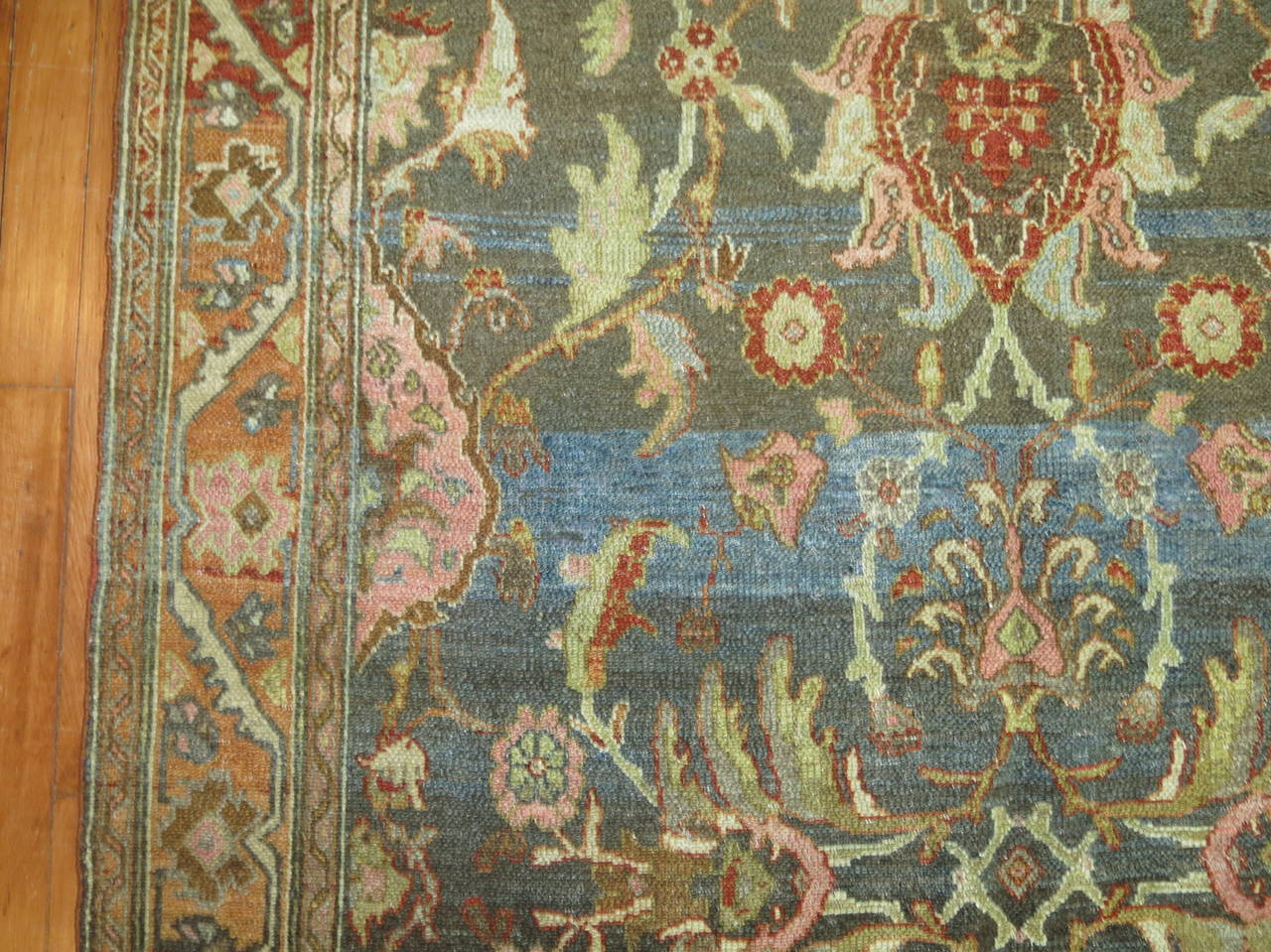 An early 20th century abrashed Persian Malayer rug.