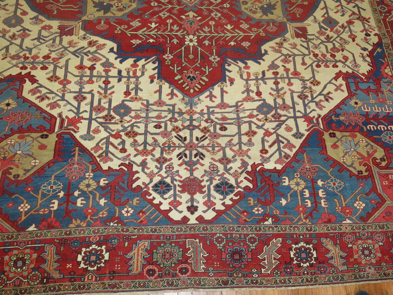 An exquisite late 19th century Persian Serapi rug.

Antique Serapi carpets were woven on the level of a family or small workshop with multiple weavers working several years to complete each Persian rug. The weaving was done almost exclusively by