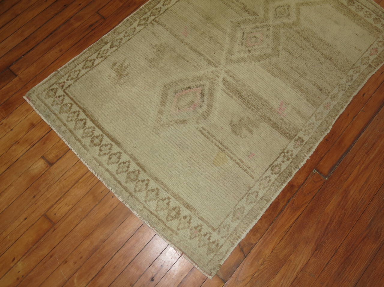 An abstract one of a kind mid-century Turkish Anatolian rug, accents in white, brown and pink.