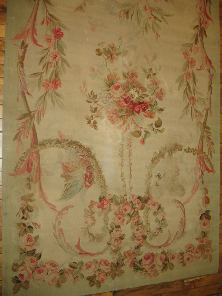 An exquisite set of ivory french tapestry Aubusson panels. 1 measuring 3 x 6'6'' and other measuring 3'10'' x 6'7''