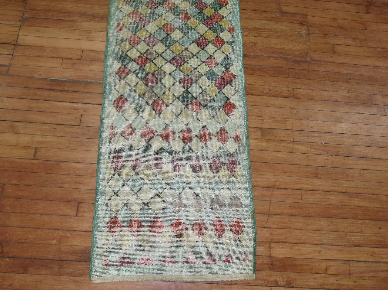 A distressed Turkish runner with an all-over diamond motif.

Measures: 2'2