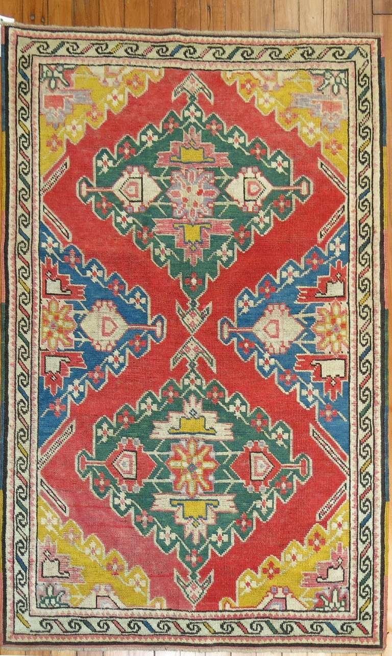 A vivacious one of a kind geometric Karabagh small rug.