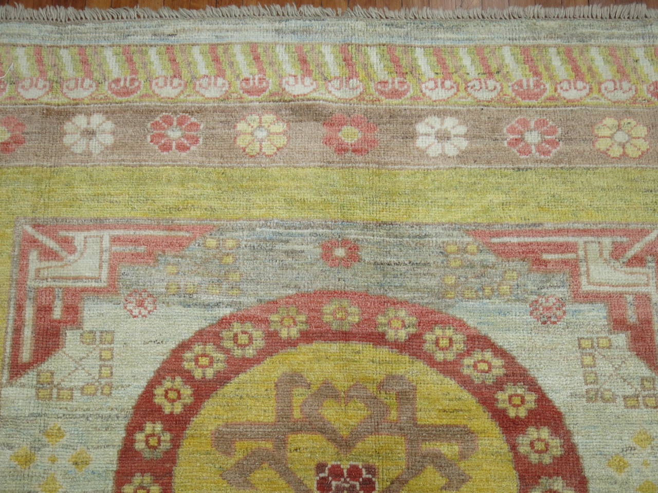 21st century vintage inspired Khotan square size rug in warm colors.

8'  x'8'9''
