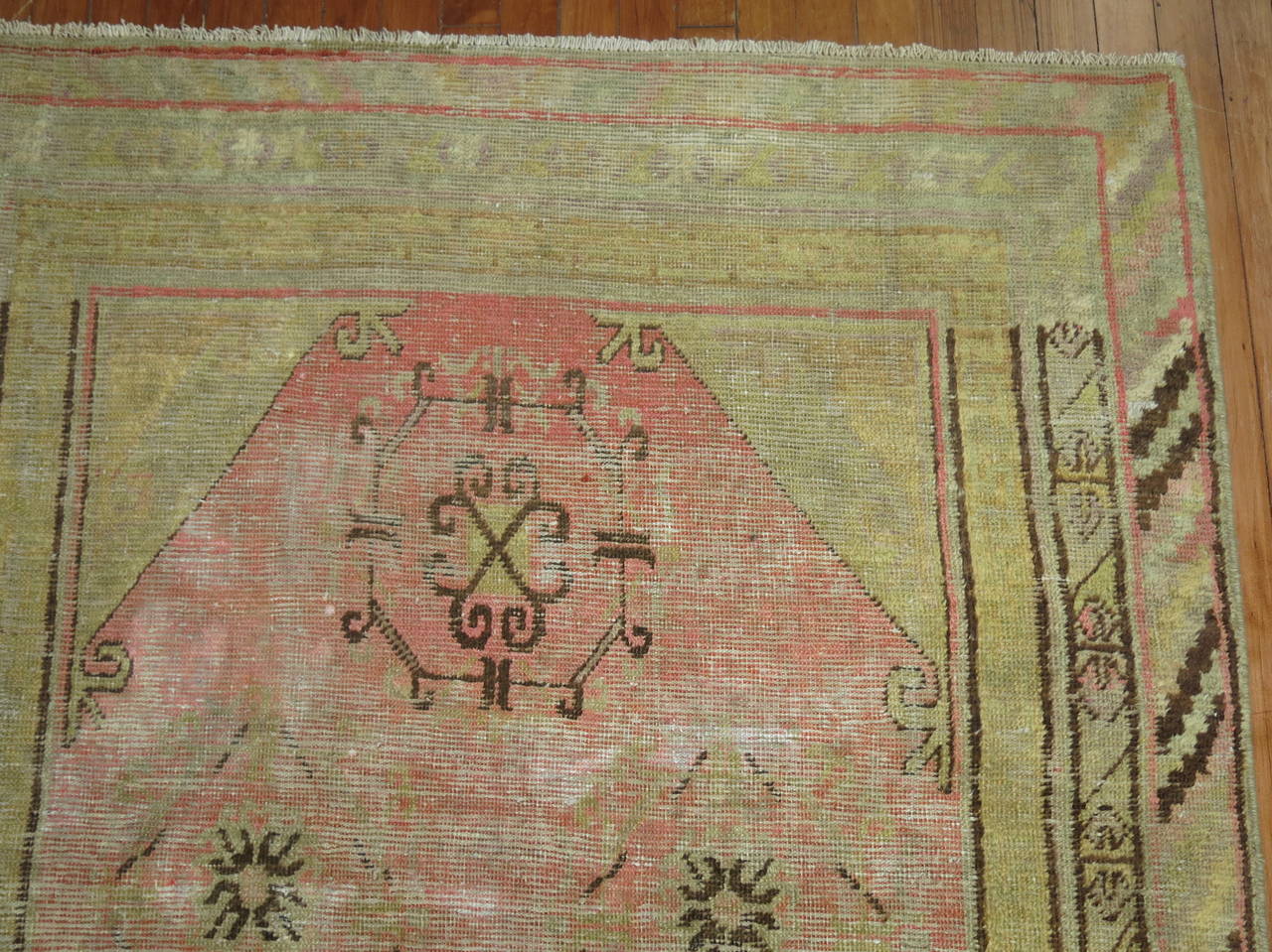 An early 20th century East Turkestan Khotan rug.