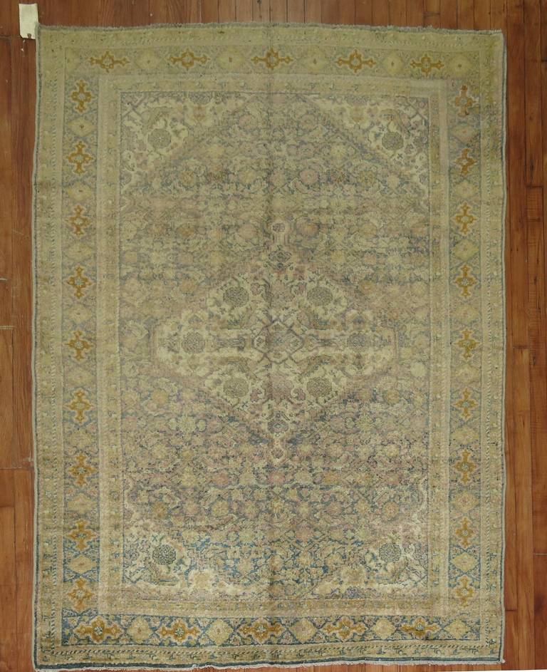 A Classic Persian mahal rug in sea foam colors with sprinkles of pink. Would make a great foyer piece!