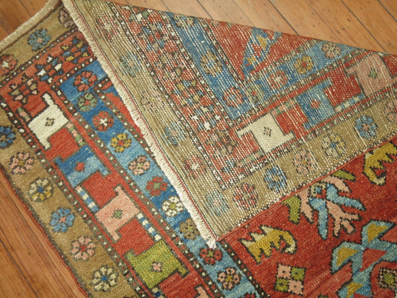 Exquisite Persian Bakshaish rug. Great colors and condition. Would make for a great wall hanging too. Light Blue and Green dominant Accents n a rusty Orange ground

Measures: 2'10'' x 3'10''

Bakshaish is widely known carpet weaving from the
