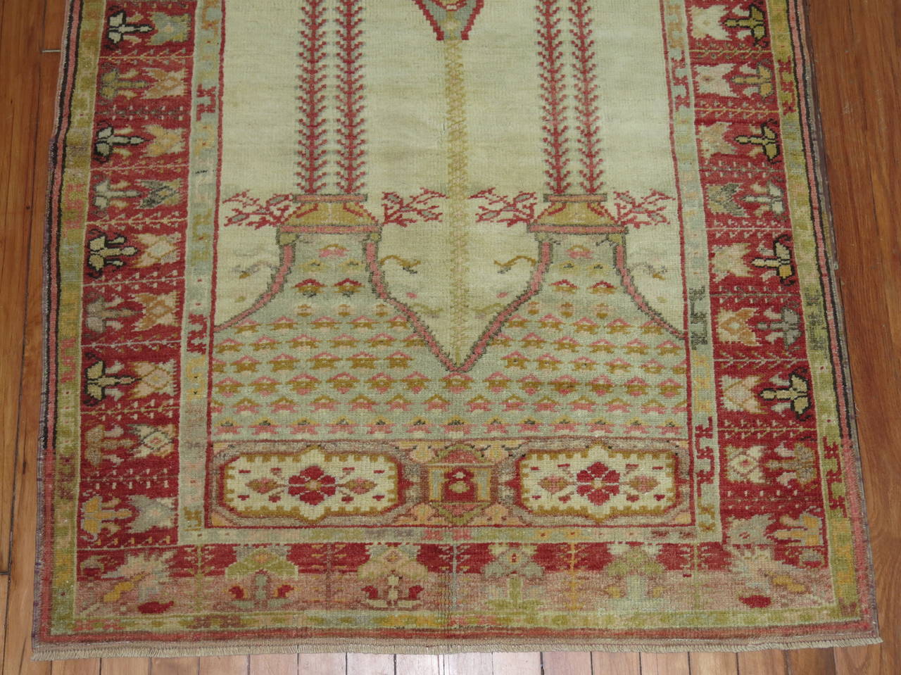 Early 20th century Turkish Oushak prayer throw rug. Ivory field and red border.