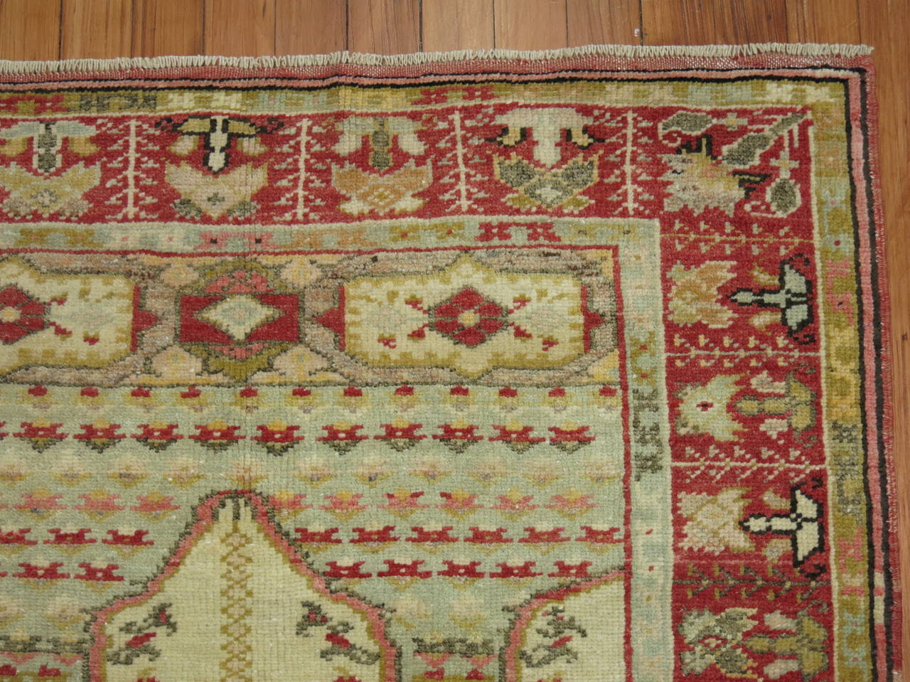 Turkish Antique Rug with Scroll Motif For Sale