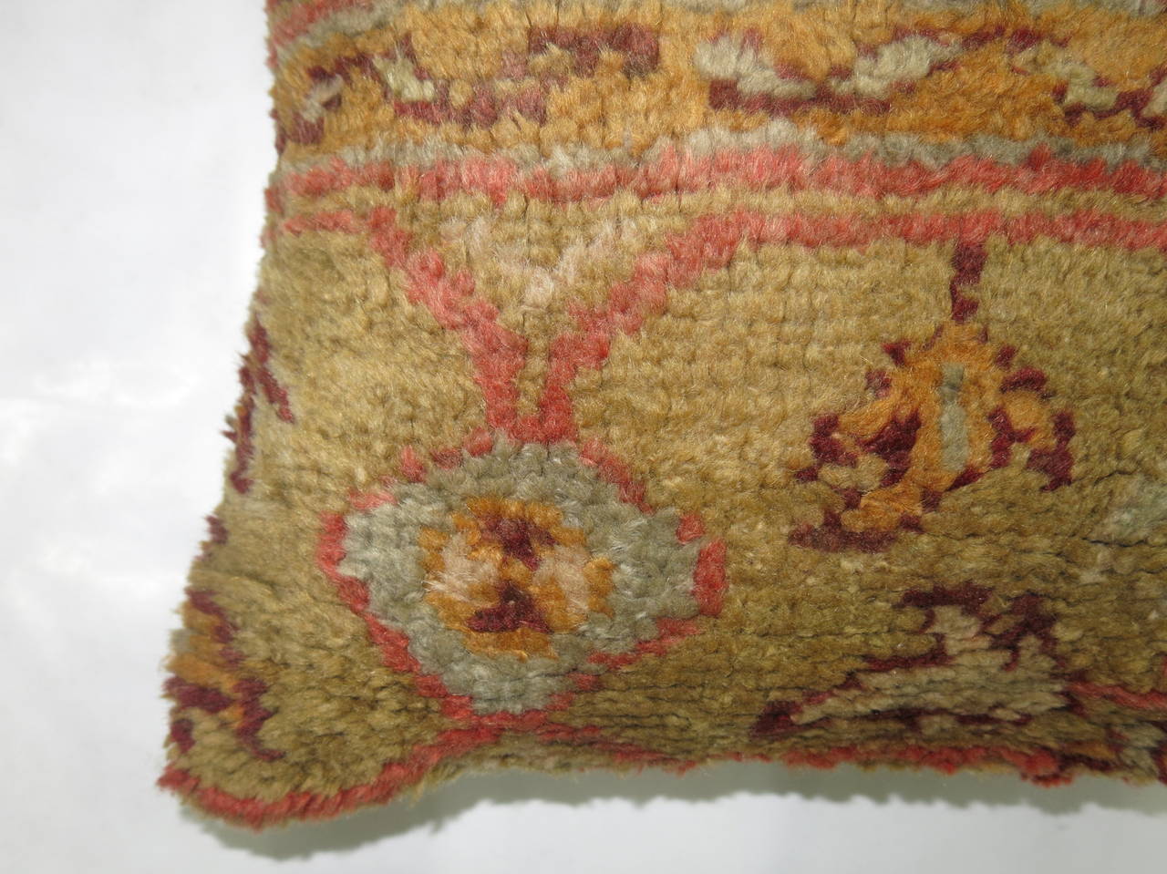 A pillow made from a 19th century antique Oushak rug.
