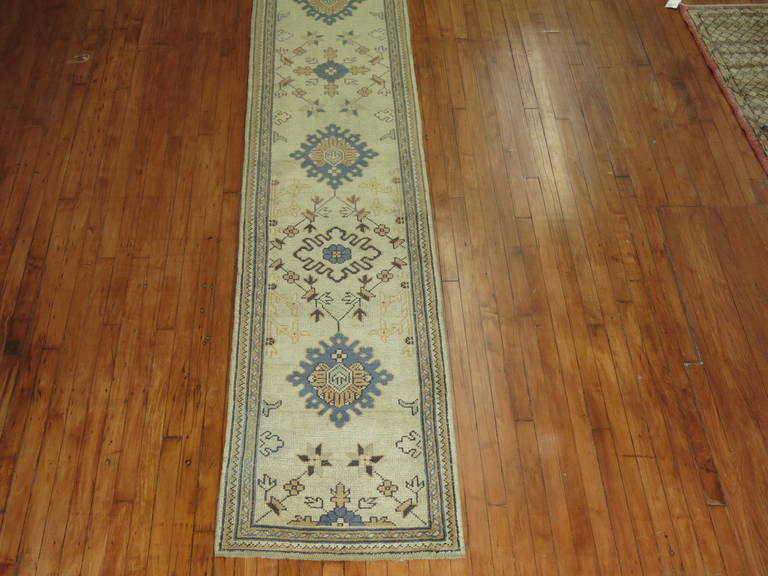 Hand-Woven Early 20th Century Ivory Field Long Antique Turkish Oushak Runner For Sale
