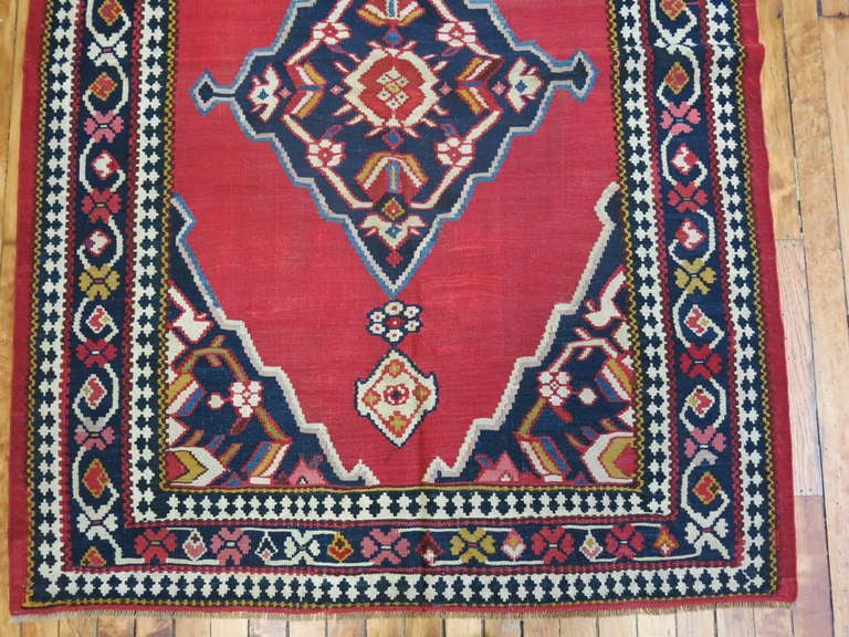 An authentic 19th century Persian Senneh Kilim. Untouched and kept in it's original state for over a century. 
Senneh Kilims were finely woven in slit tapestry with delicate patterning formed by eccentric wefts.

4' x 5'6''
