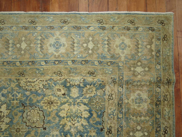Pale watery blue tightly woven early 20th century Persian Tabriz rug.

Measures: 9'5'' x 12'10''.