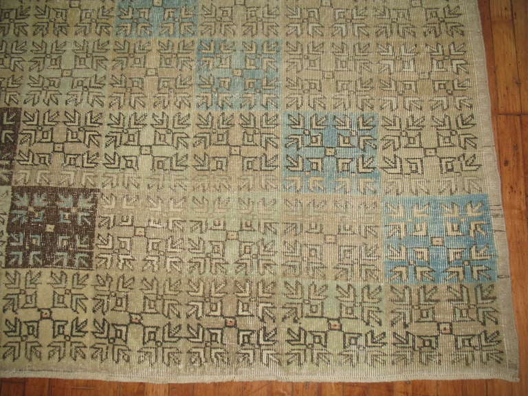 Quite a decorative midcentury Turkish rug woven in central Anatolia. Predominantly beige, accents in brown, khaki, light green and sky blue,

circa mid-20th century. Measures: 6'3
