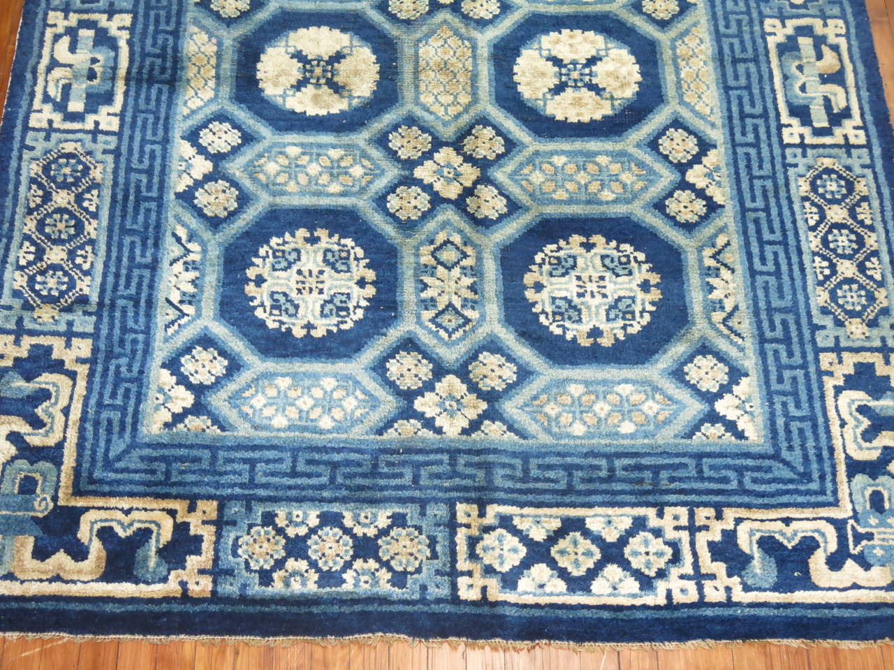 An authentic rare size antique Chinese Peking rug in blue and ivory.