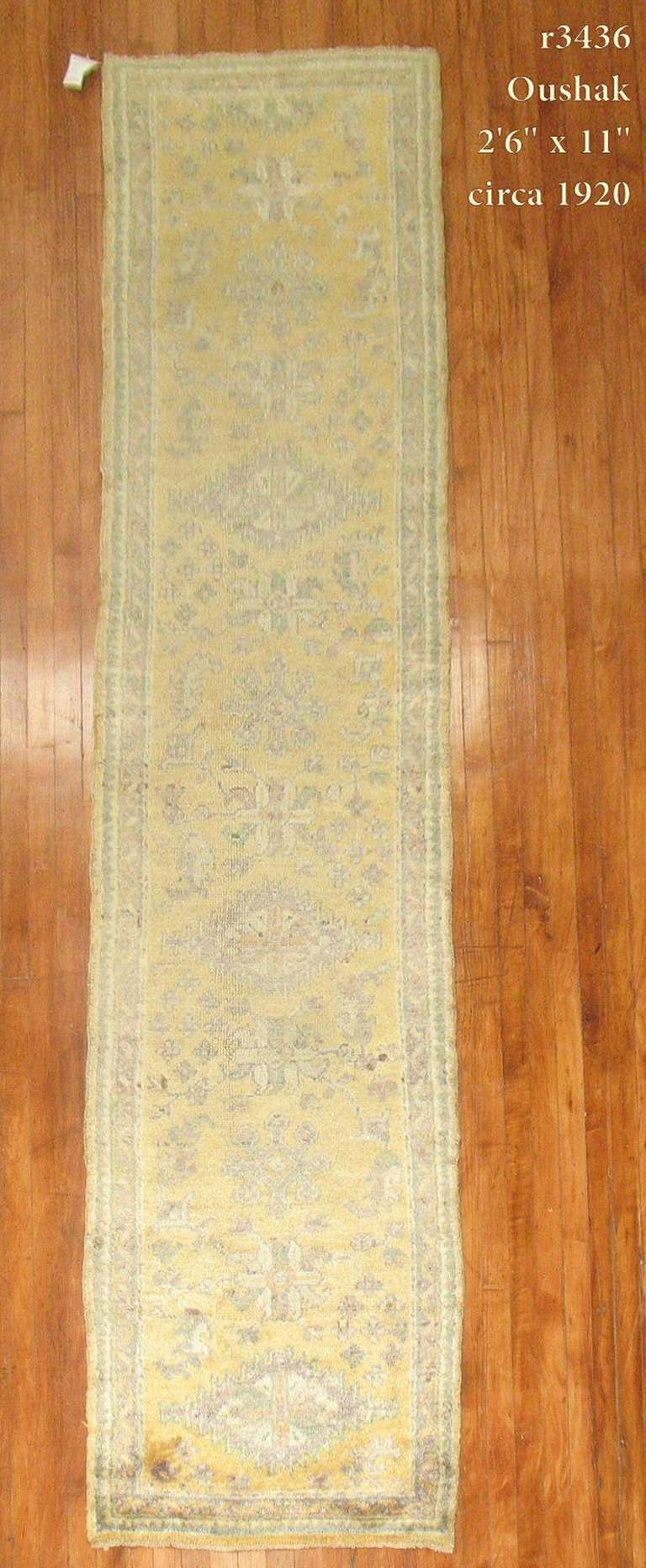 An antique Oushak runner in saffron and chartreuse with shades of lavender.

2'6'' x 11'