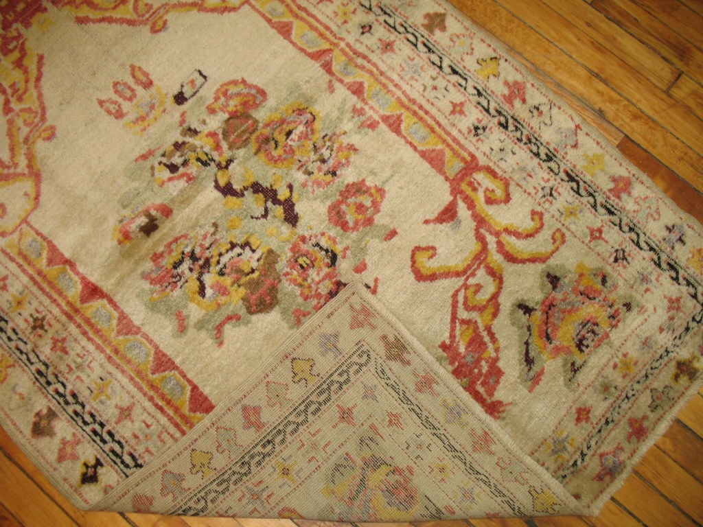An early 20th century Turkish ghiordes rug.