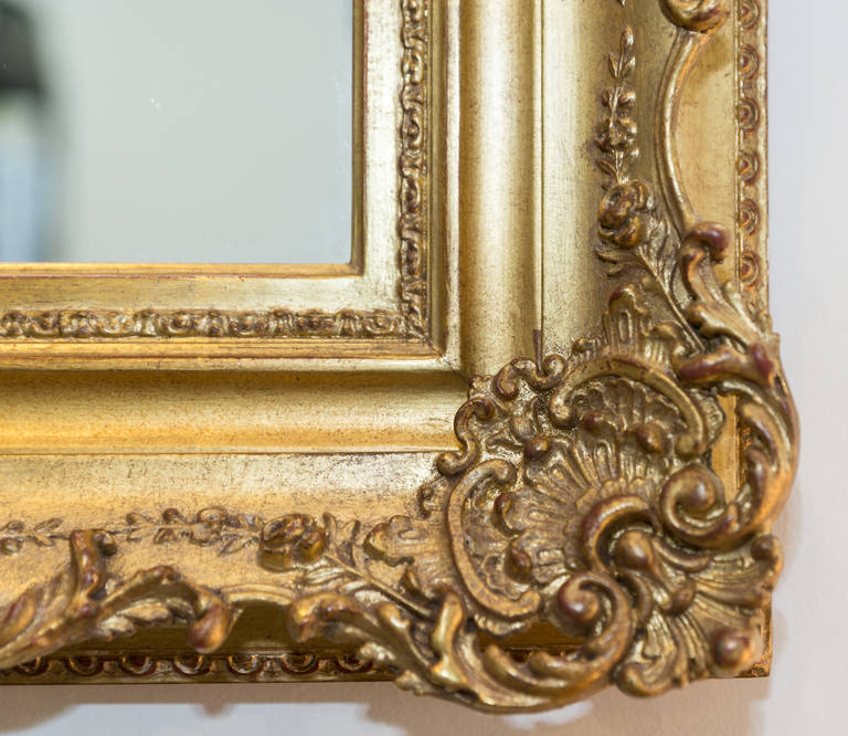 19th Century restored gold gilt Regence Style frame with new mirror.