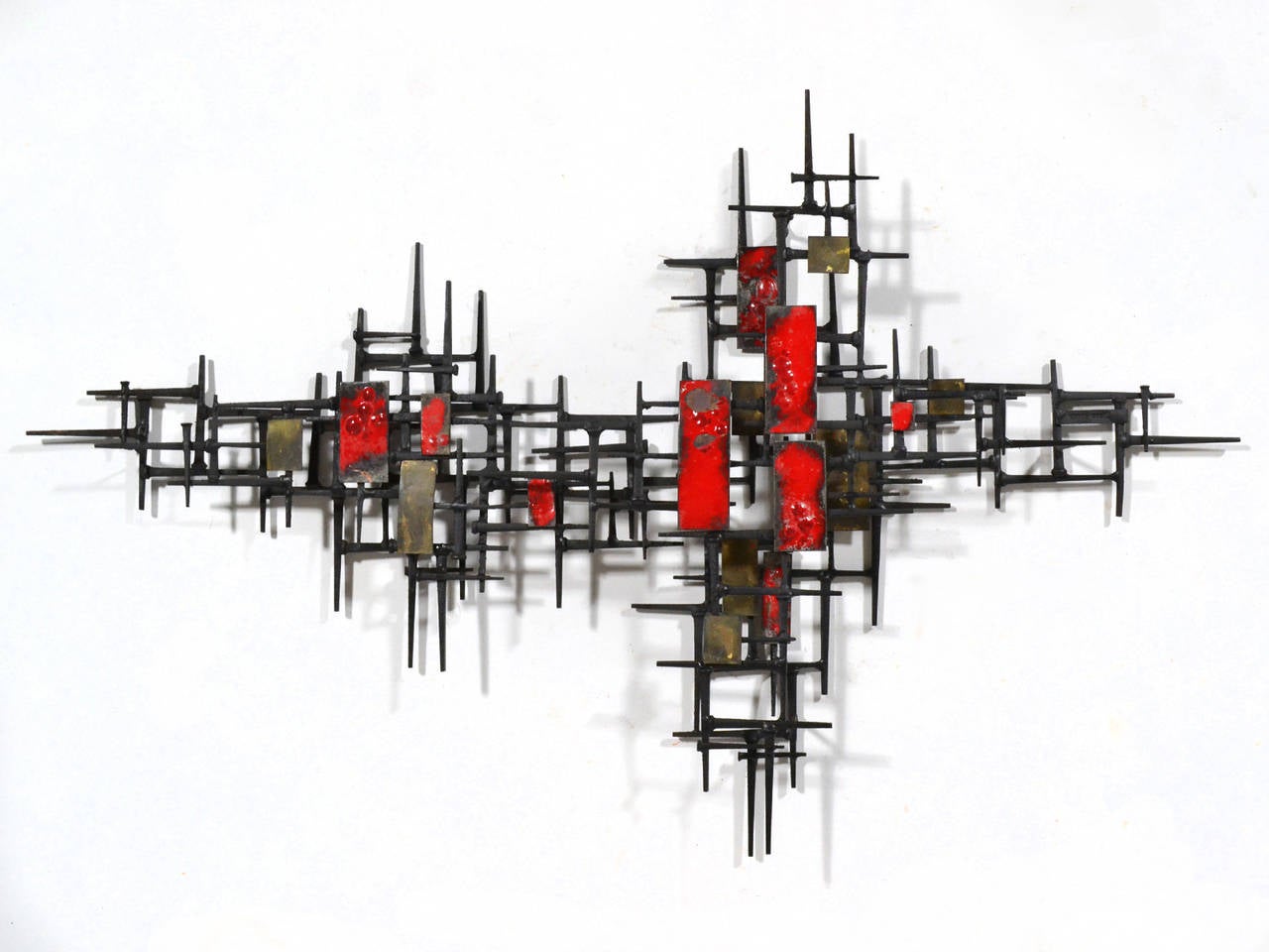 A dynamic composition in a mix of materials, this wall sculpture by Carol Steg is a vibrant piece which will activate any space. It can be hung in different orientations, each of which have appeal. Some might call the style of this sculpture