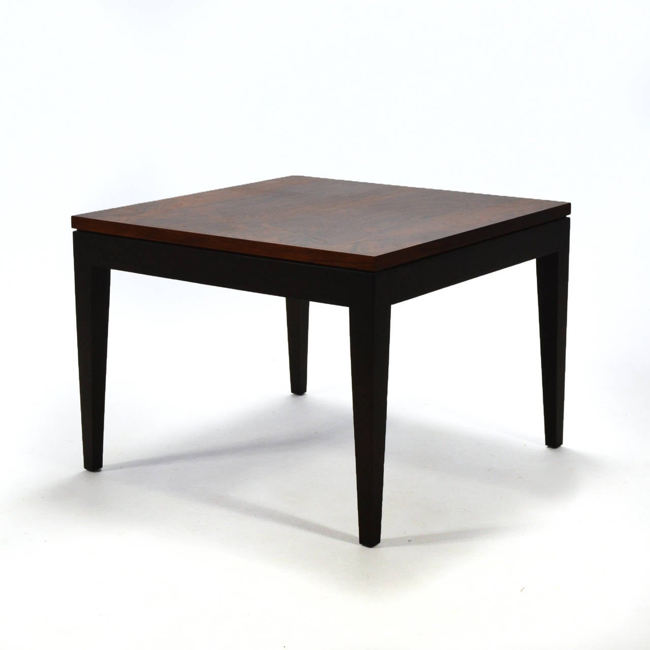 This end table has a stunningly beautiful top of rich, highly figured rosewood supported by an ebonized black base. Like all Knoll pieces it is impeccably constructed and features refined details like the subtle reveal between the top and the base.