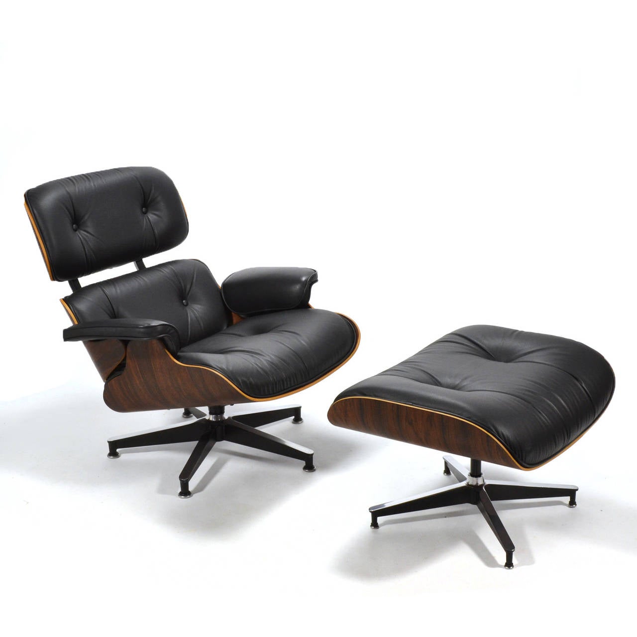 A pristine example of the iconic 670 lounge chair and 671 ottoman by Charles and Ray Eames. This vintage set has been fully restored and upholstered with top quality Edleman leather. The figuring of the rich rosewood on the shells is particularly