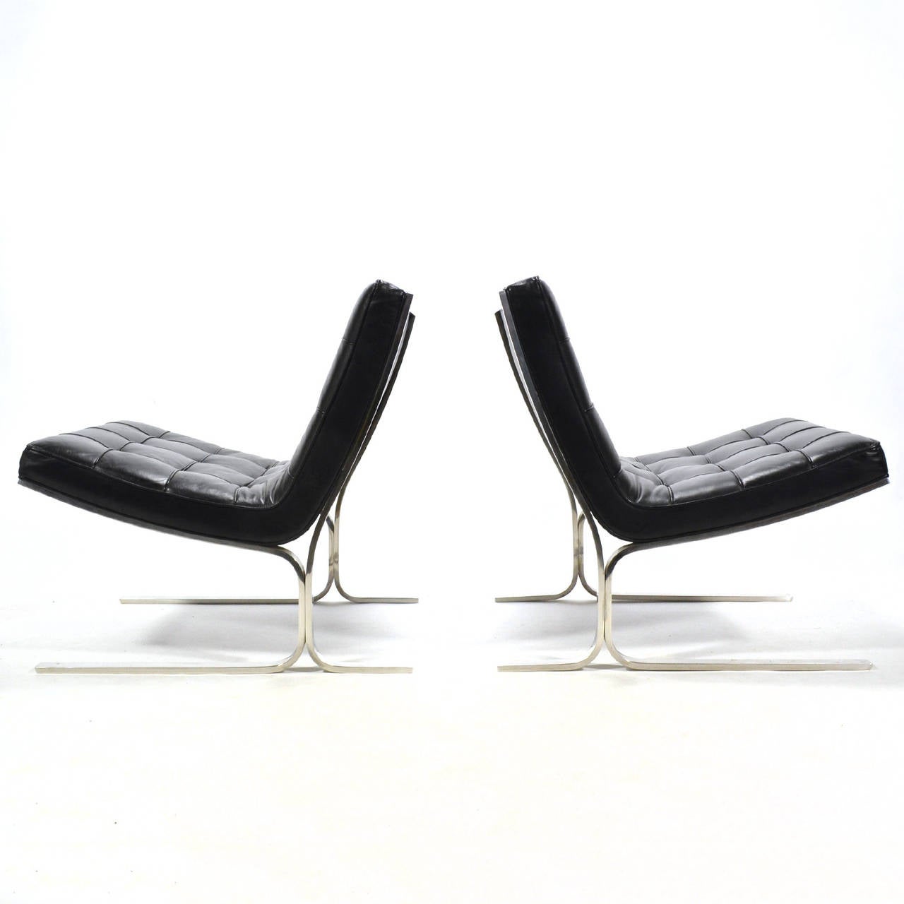 Sublimely beautiful and impeccably constructed, the 28 lounge chair by Nicos Zographos has qualities similar to Mies' Barcelona chair. However without the visible straps supporting loose cushions, it perhaps offers an even more spare, minimal