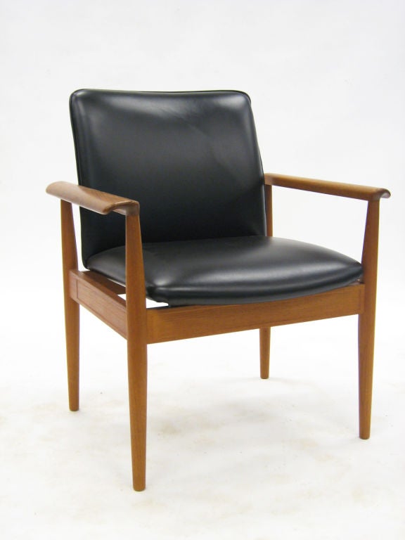 The model 209 or “Diplomat” armchair was designed by Finn Juhl in 1961 and made by France & Son. The design perfectly illustrates Juhl’s practice of clearly delineating the upholstered seat and back from the sculpted wood frame. A great occasional