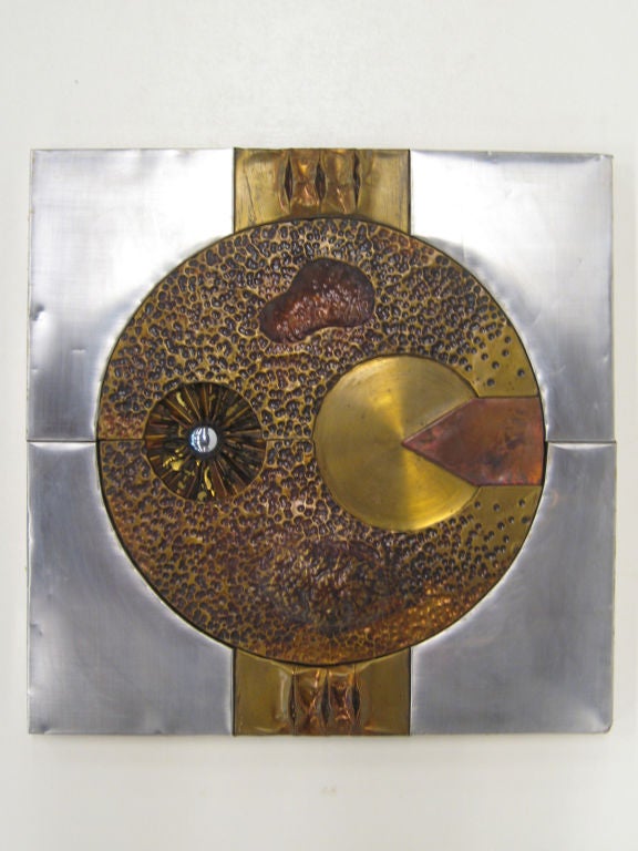 Bas relief artwork in mixed metals by H. Chow.