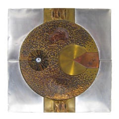 Bas relief artwork in mixed metals by H. Chow.