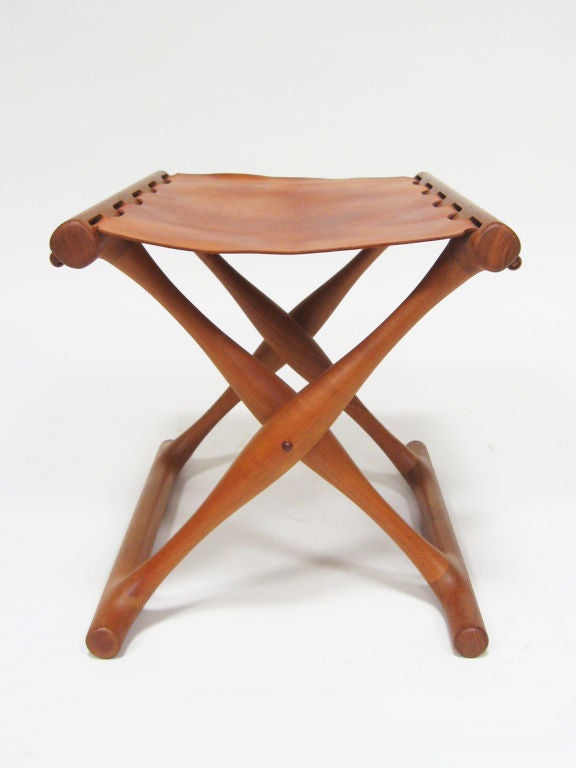 Based on an early bronze-age form, this beautiful stool is in exceptional condition with a perfect patina to the original cognac colored leather.