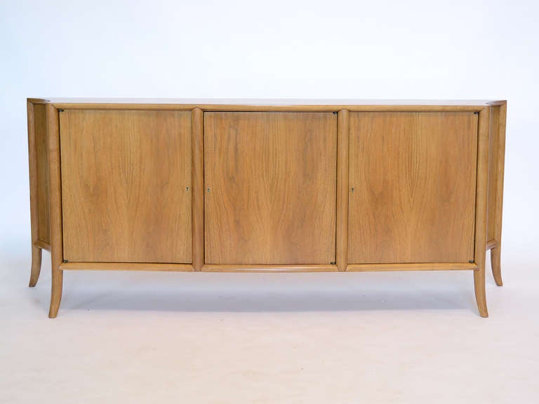 This credenza by T.H. Robsjohn-Gibbings is simply breathtaking. Designed to accompany the 