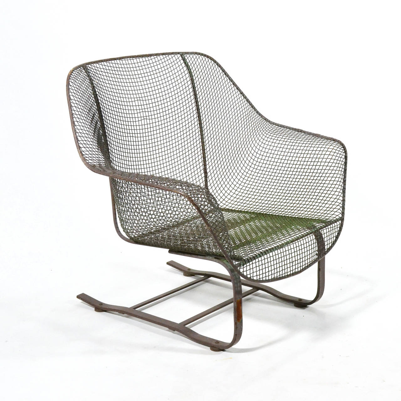 The Sculptura line by Russell Woodard is an enduring design for comfortable and long lasting modern outdoor furniture. The wrought iron frame covered in sculpted wire mesh references the organic designs of Eames and Saarinen and parallels their