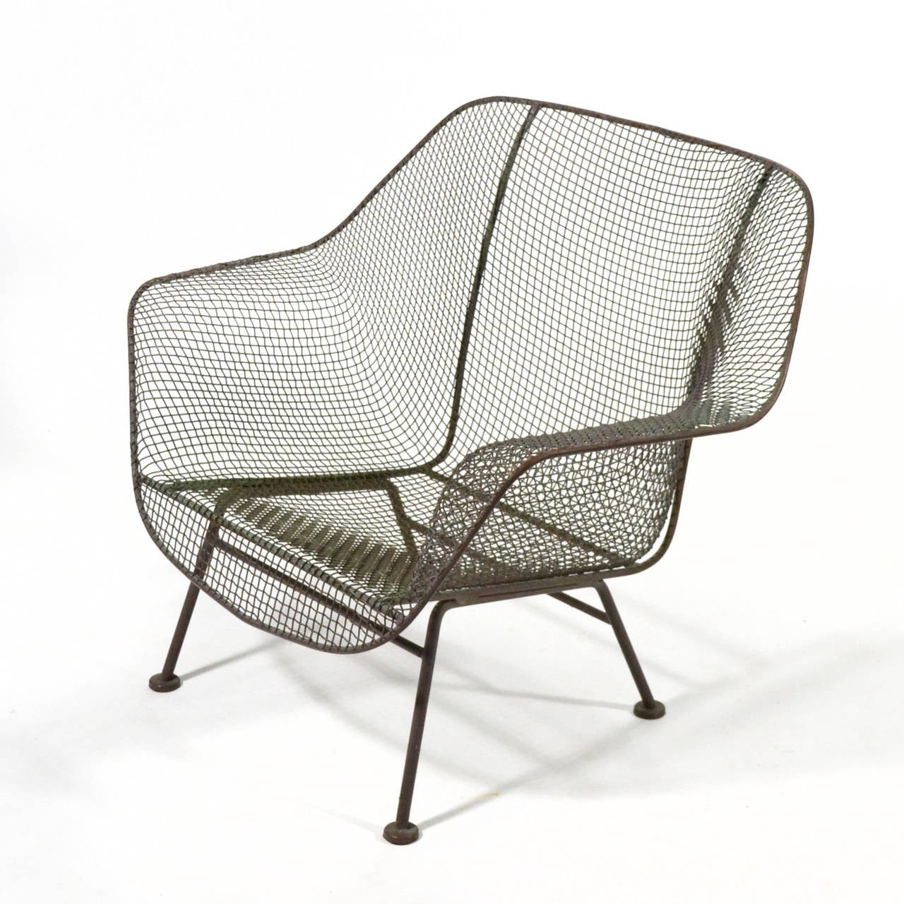 The Sculptura line by Russell Woodard is an enduring design for comfortable and long lasting modern outdoor furniture. The wrought iron frame covered in sculpted wire mesh references the organic designs of Eames and Saarinen and parallels their