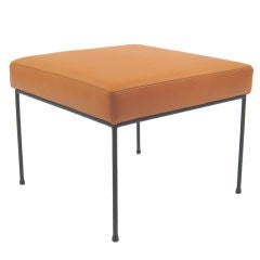 Paul McCobb stool with iron base in orange leather